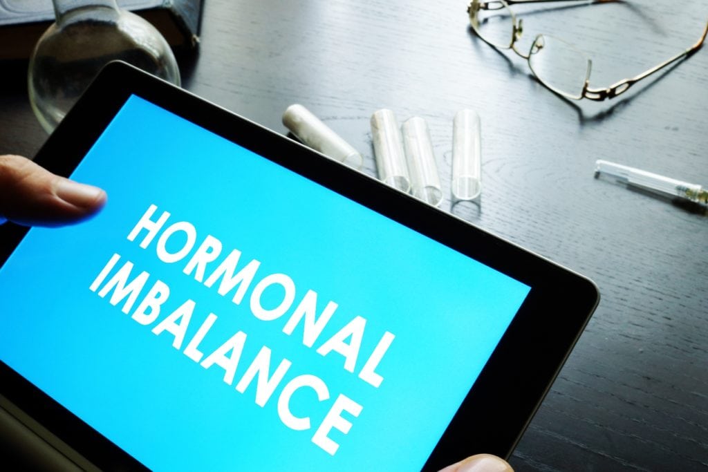 Hormonal imbalance sign on a tablet.